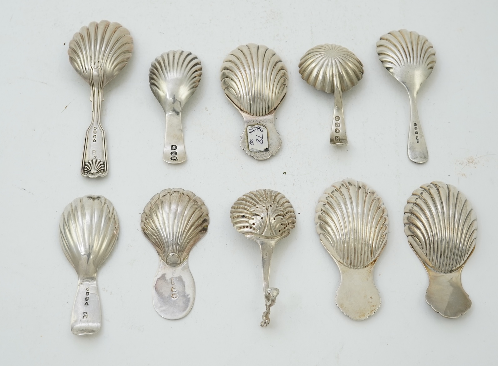 Ten assorted 19th and 20th century silver caddy spoons, with shell or fluted bowls